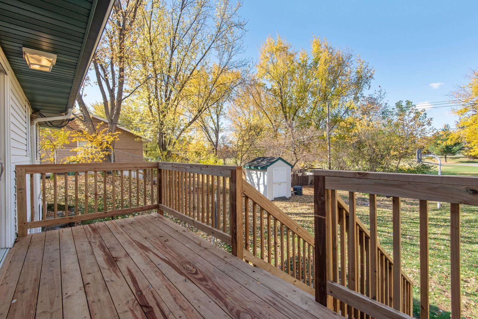 Custom built backyard deck with railings by KP Landscaping in Buffalo NY