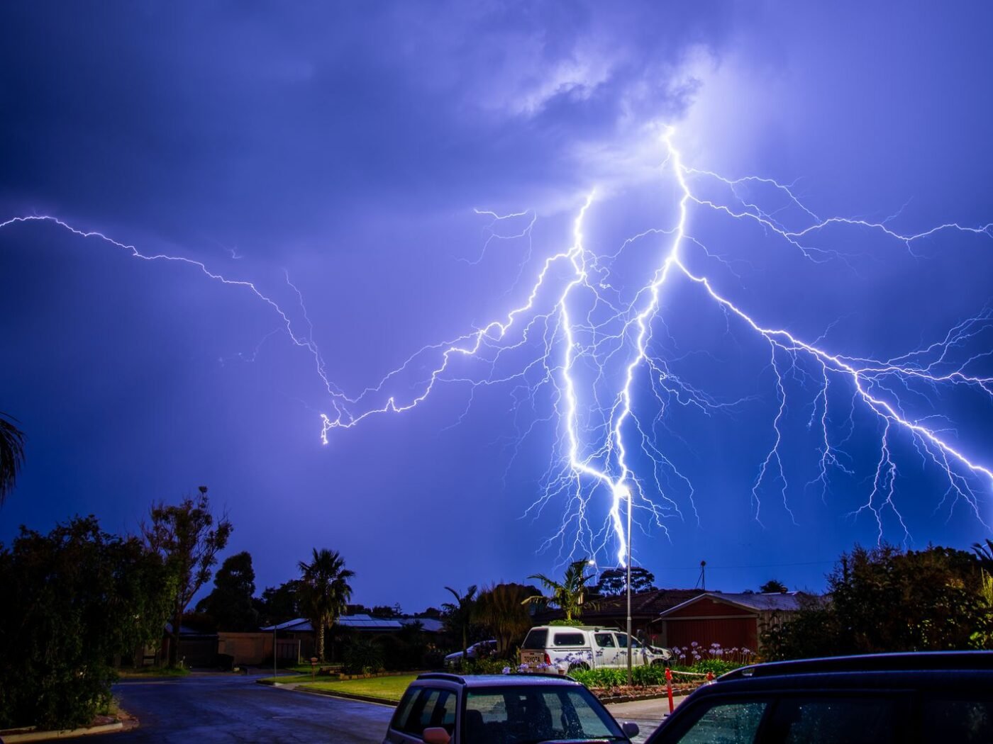 Storm-response photo. Bucket truck at night