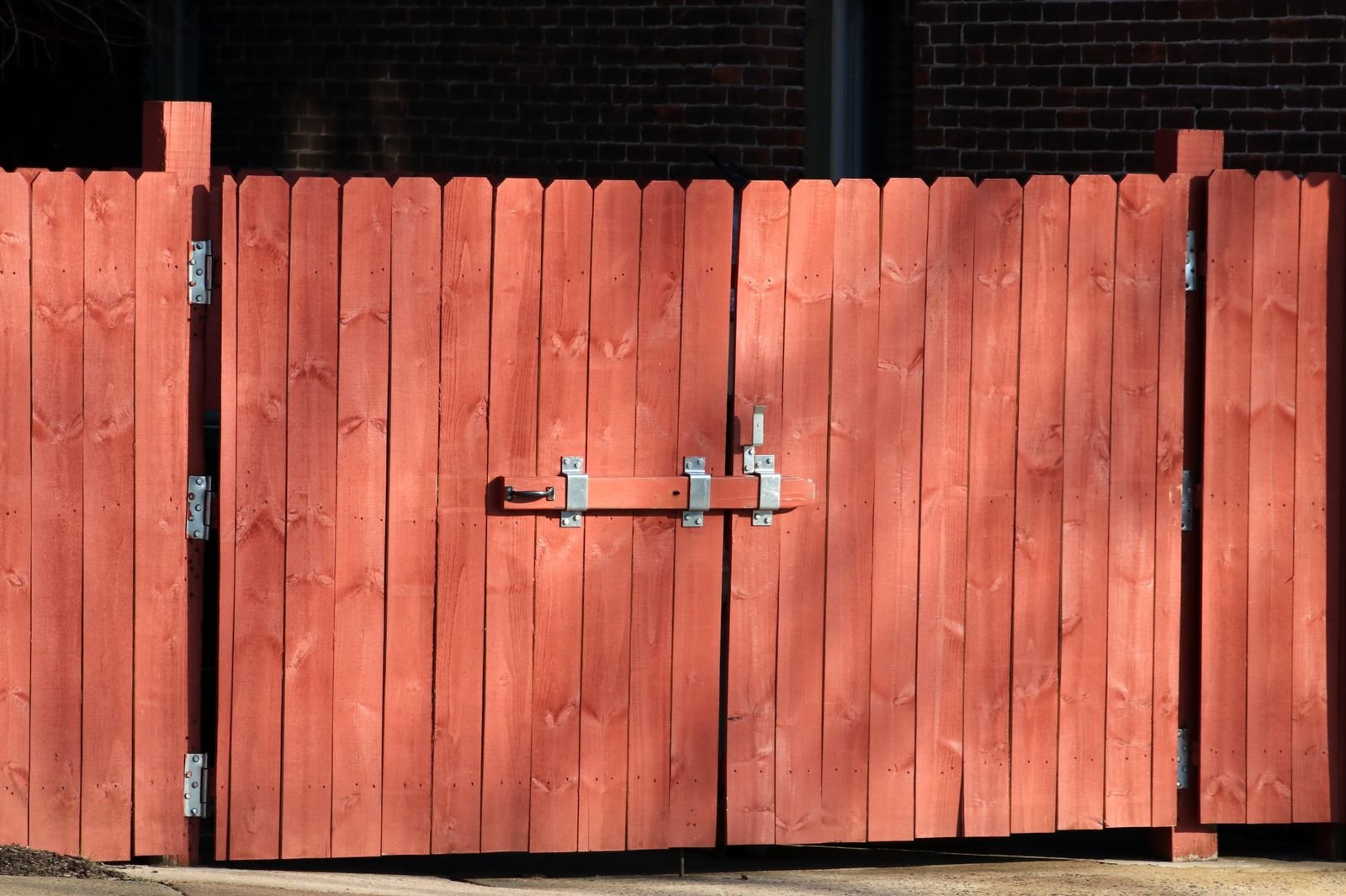 Wooden gate installed in a fence line by KP Landscaping in Buffalo NY