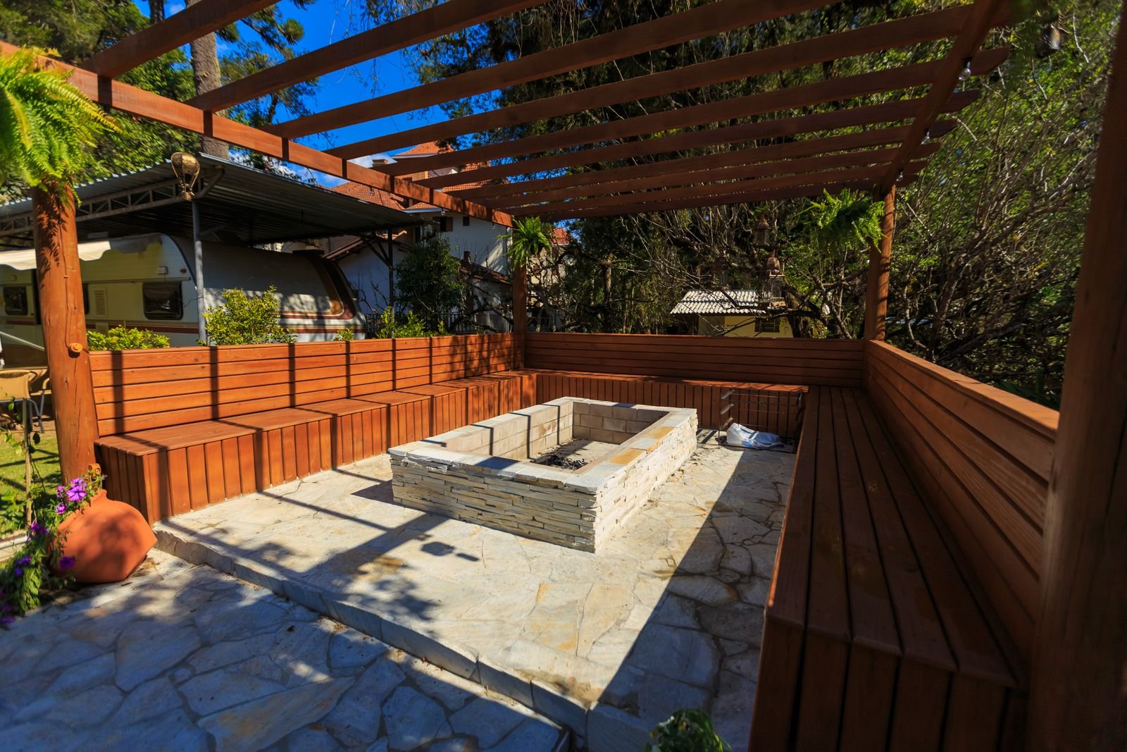 Stone fire pit built into a paver patio by KP Landscaping in Buffalo NY