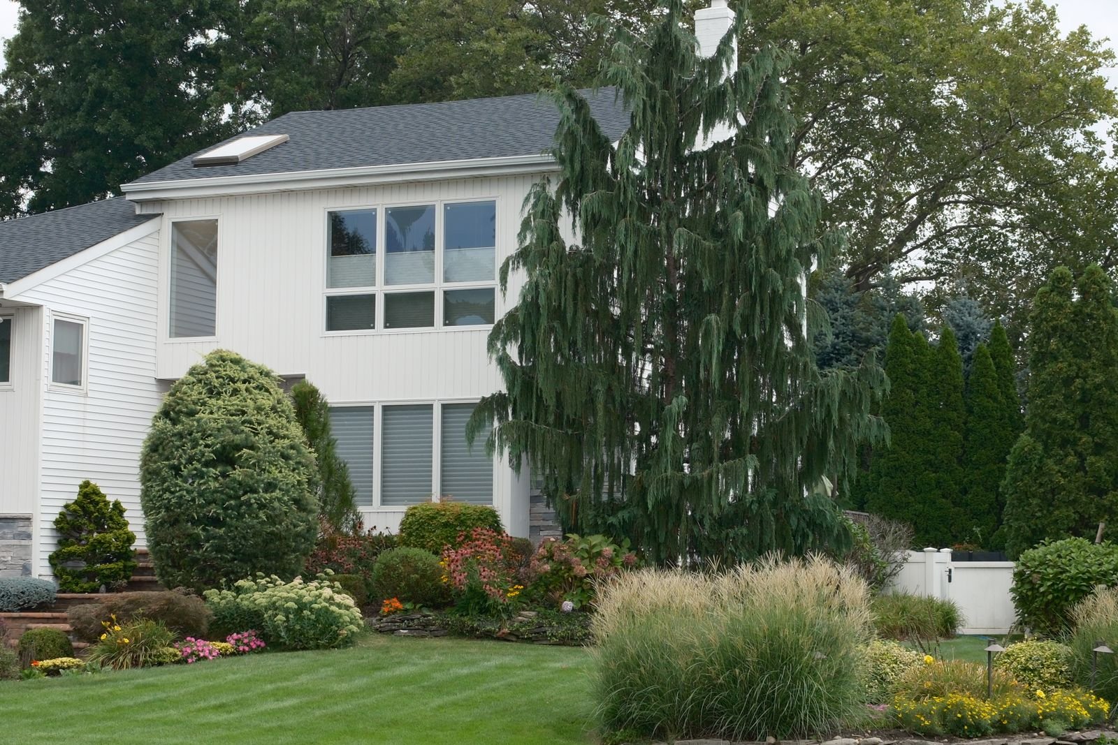 Finished residential landscape with layered plantings by KP Landscaping in Buffalo NY