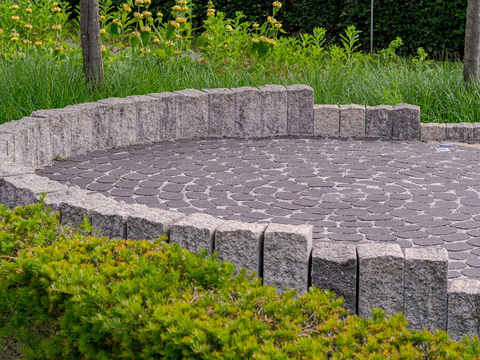 Paver patio installation with cut border stones by KP Landscaping in Buffalo NY